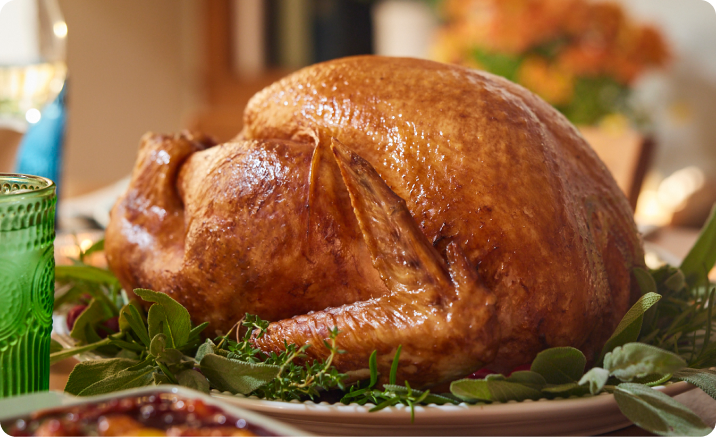 A fully cooked Butterball Cook from Frozen turkey on a Thanksgiving table.