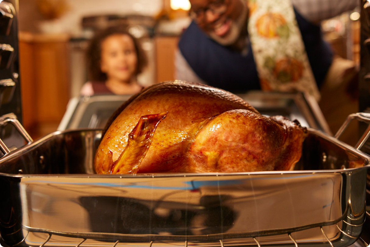 2024 Cook from frozen, roaster pan A Butterball Cook from Frozen turkey, in a roasting pan, with a family in the background