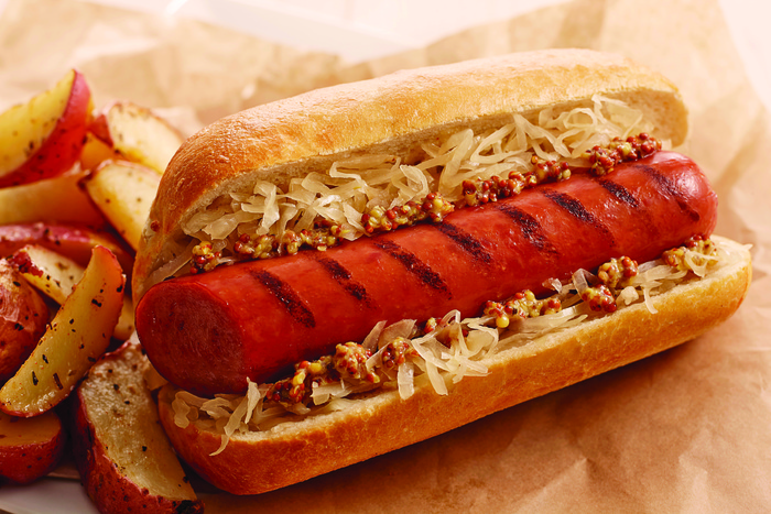 Image of Grilled Smoked Sausage and Sauerkraut on a Bun Image of Grilled Smoked Sausage and Sauerkraut on a Bun