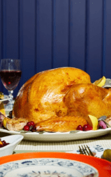 A prepared turkey on a Thanksgiving table.