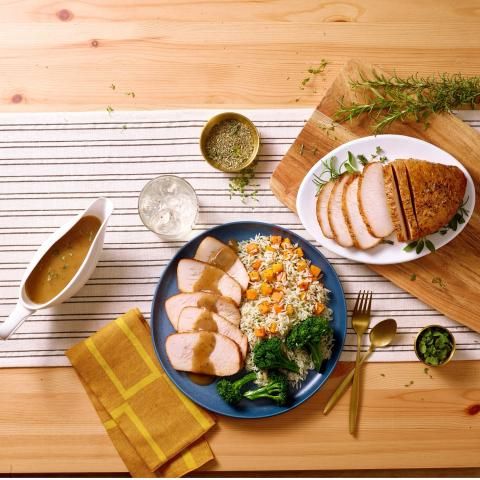Image of a plate of turkey with gravy and other tasty fixings.