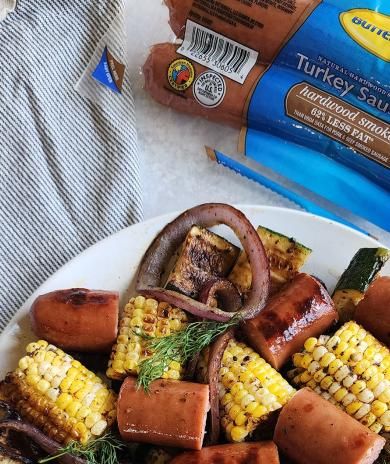 Image of Grilled Sausage and Vegetables with Garlic Butter.