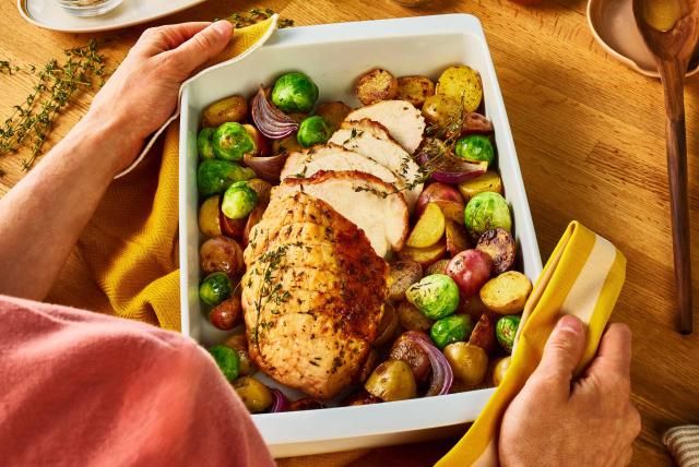 A Butterball roast turkey breast with thyme lemon sauce, brussels sprouts, and red onion. 